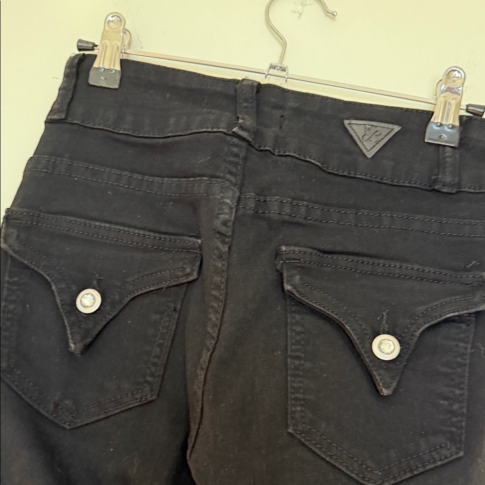 Red bottoms bell bottom jeans with triangular pockets and gem buttons